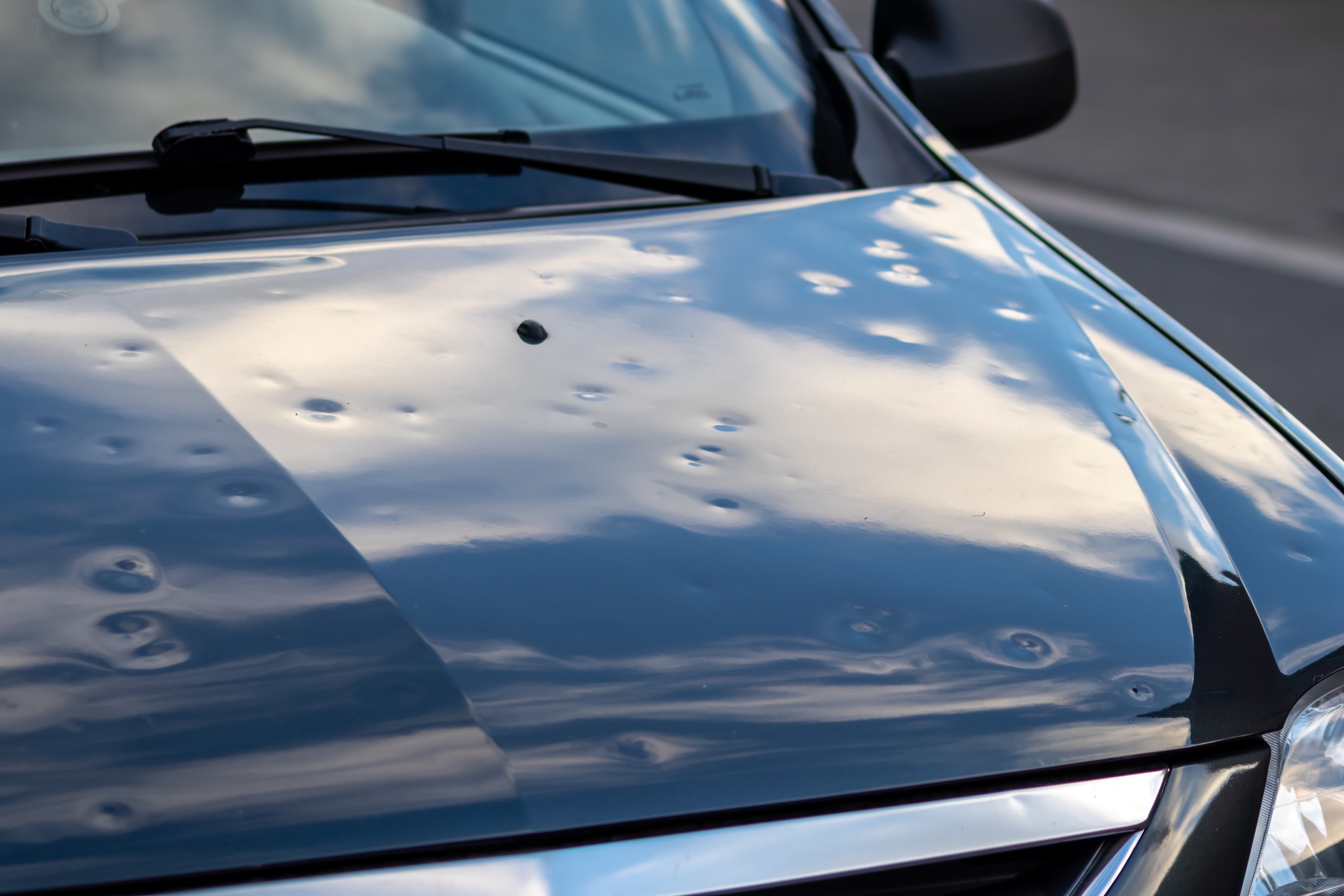 Hail-damaged vehicle undergoing collision repair at a D&S Automotive center in Northeast Ohio